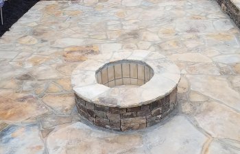 fllagstone patio with a firepit