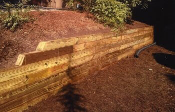 wooden retaining walls in a yard