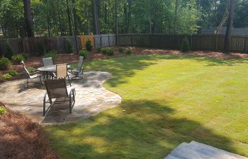 backyard flagstone patio with garden furniture