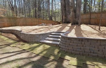 gravel patio with steps to the garden
