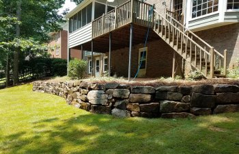 a house with hardscapes installed in the backyard