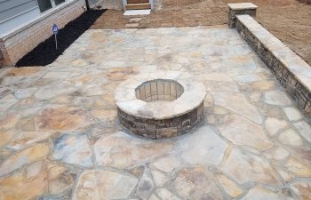 flagstone patio with a fire pit